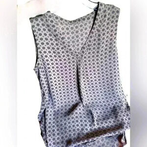 Size medium taupe, black , white sleeveless shell top. V neck with front pleat